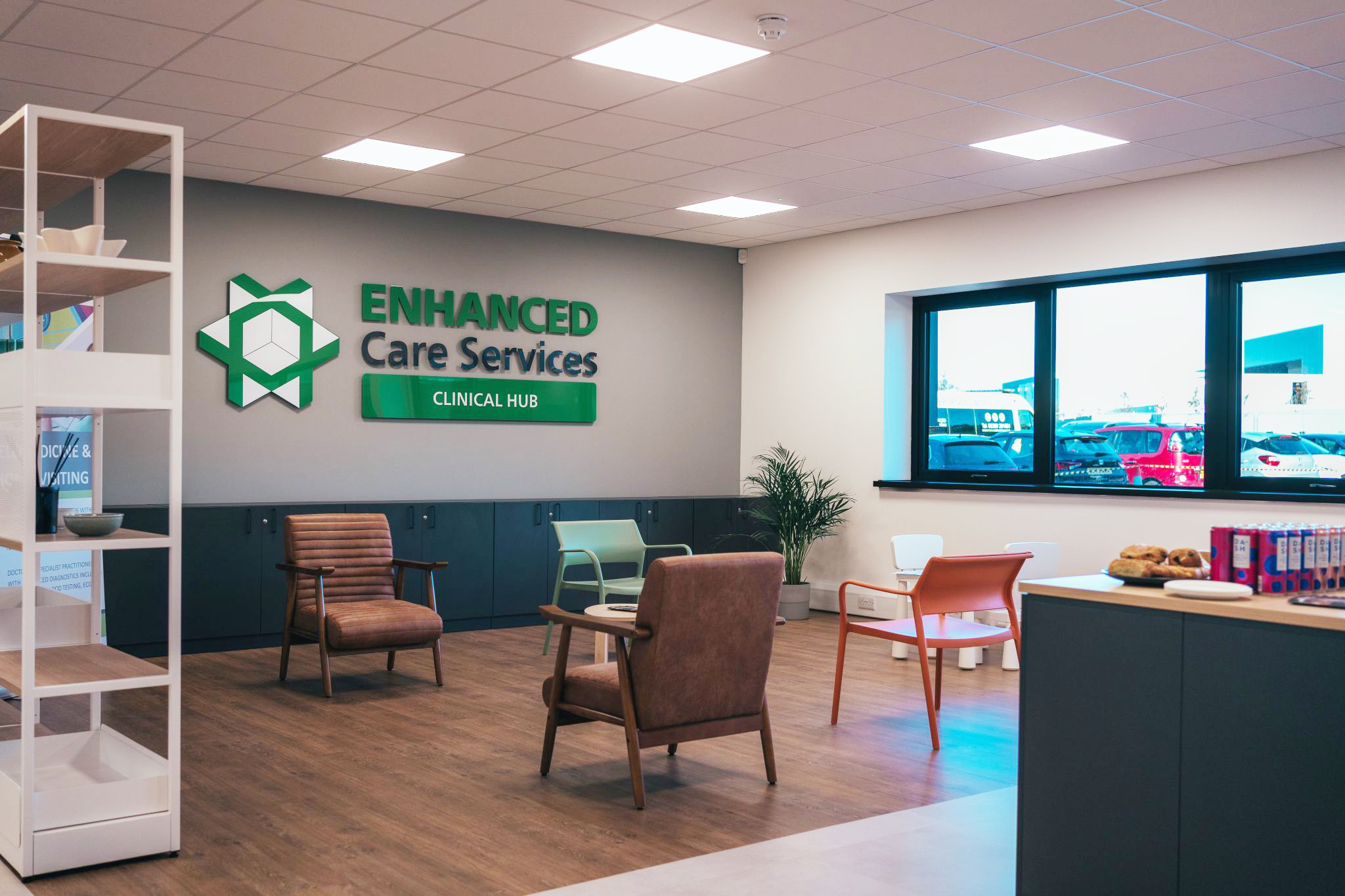 Patient seating room with Enhanced Care Services signage