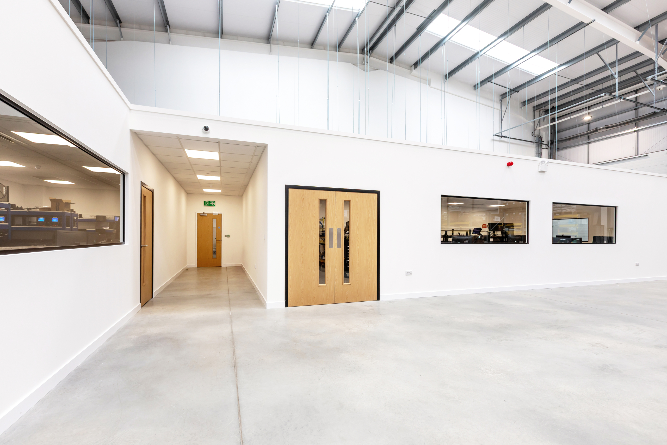 Workshop room with double doors and leading hallway