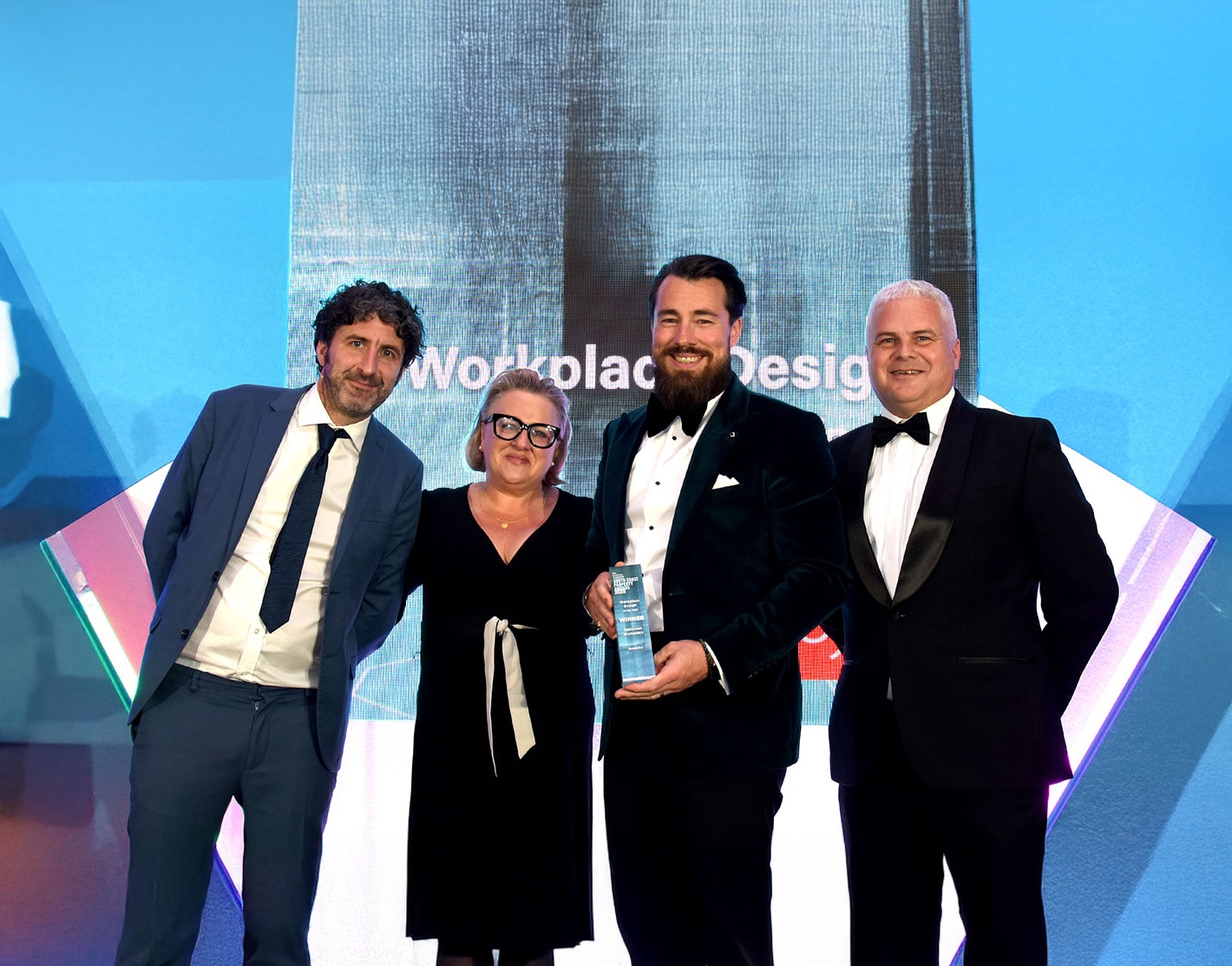 The Spectrum team win a Workpalce design award at an award ceremony