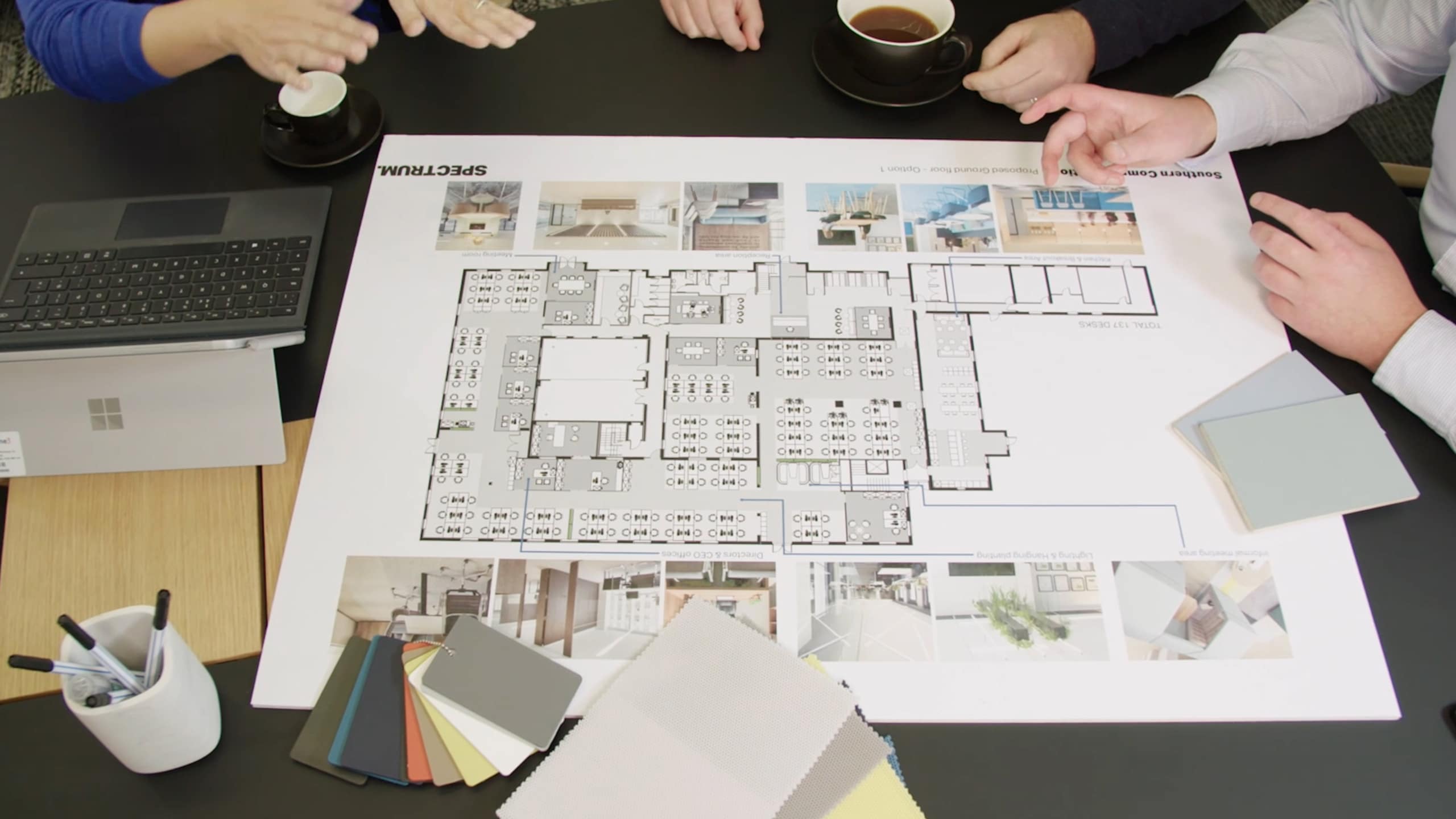 Spectrum colleagues collaborate over Interior Architecture & Design plans